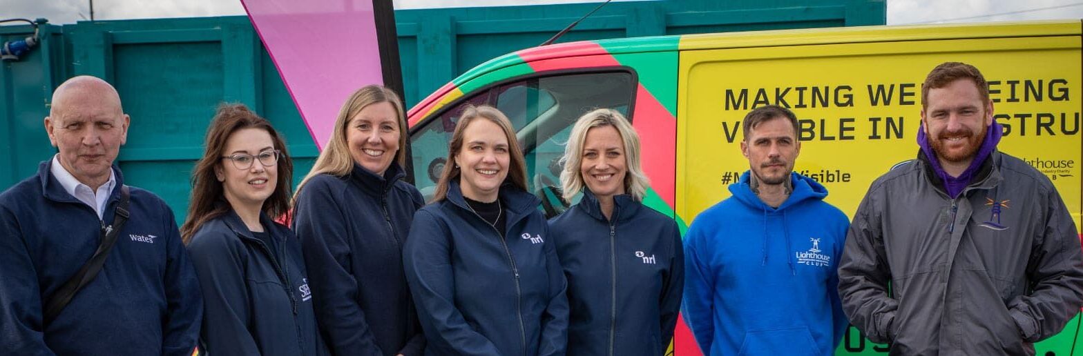 Sunderland colleagues and members of the Lighthouse Charity standing next to their van.